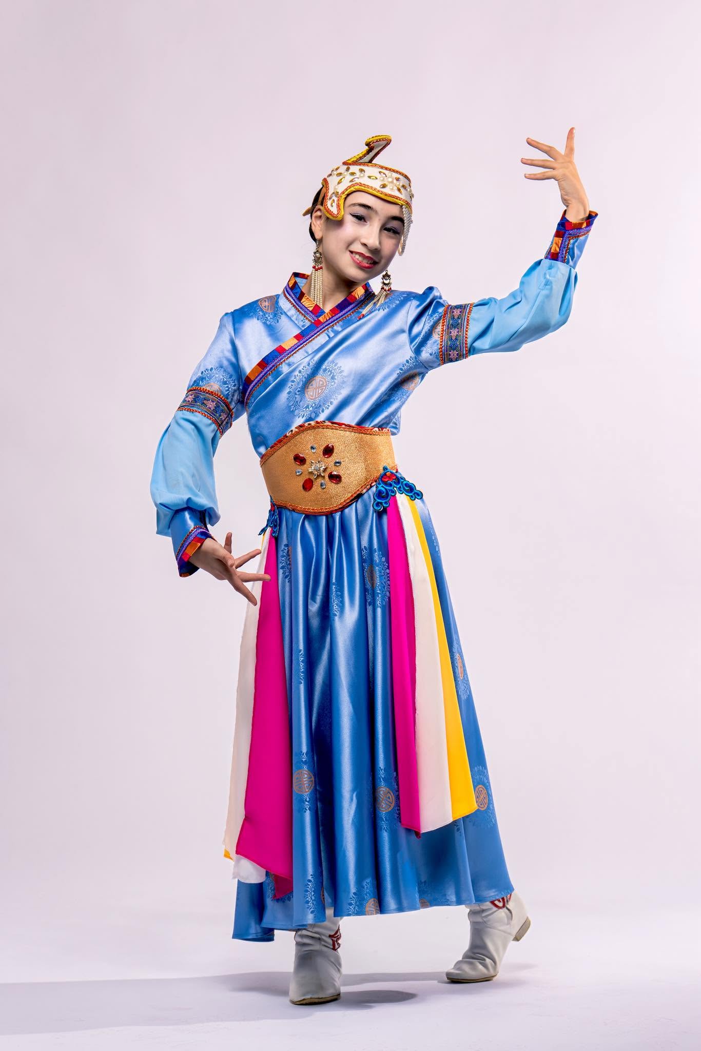 Mongolian dancer in a blue traditional costume