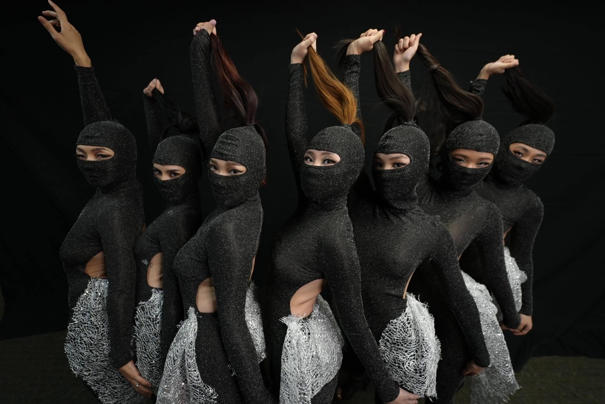 Contemporary dancers in a coordinated formation